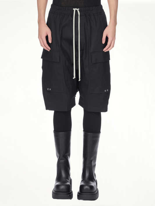Image of a model wearing Shorts. Productname: RICK OWENS Cargo Pods Shorts in Black colour by brand - RICK OWENS