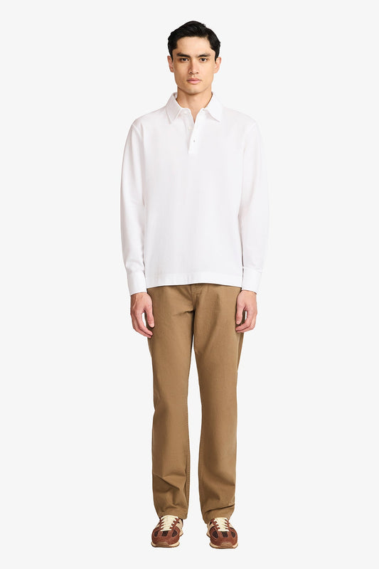 Image of a model wearing Tops. Productname: Anthony Squires Raffa White Knitted Polo in White colour by brand - Anthony Squires