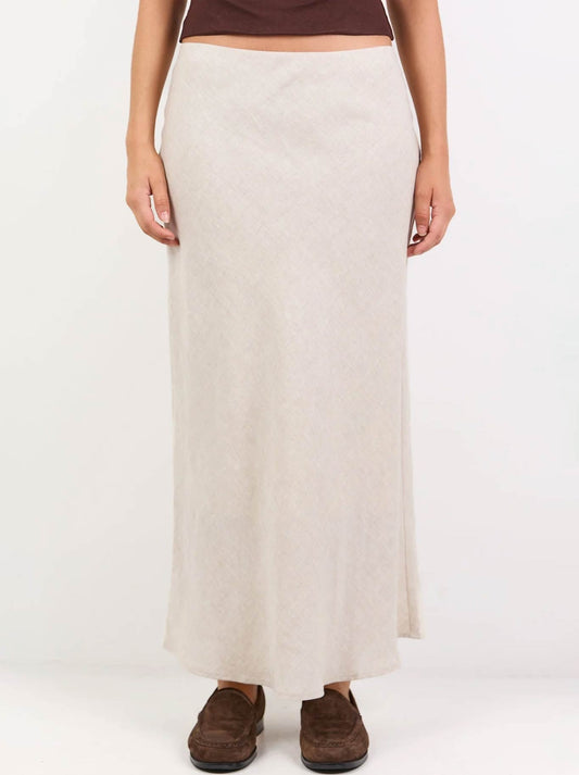 Image of a model wearing Skirts. Product name - Re:Union The Label Bliss Linen Bias Midi Skirt in Natural colour by brand - Re:Union The Label