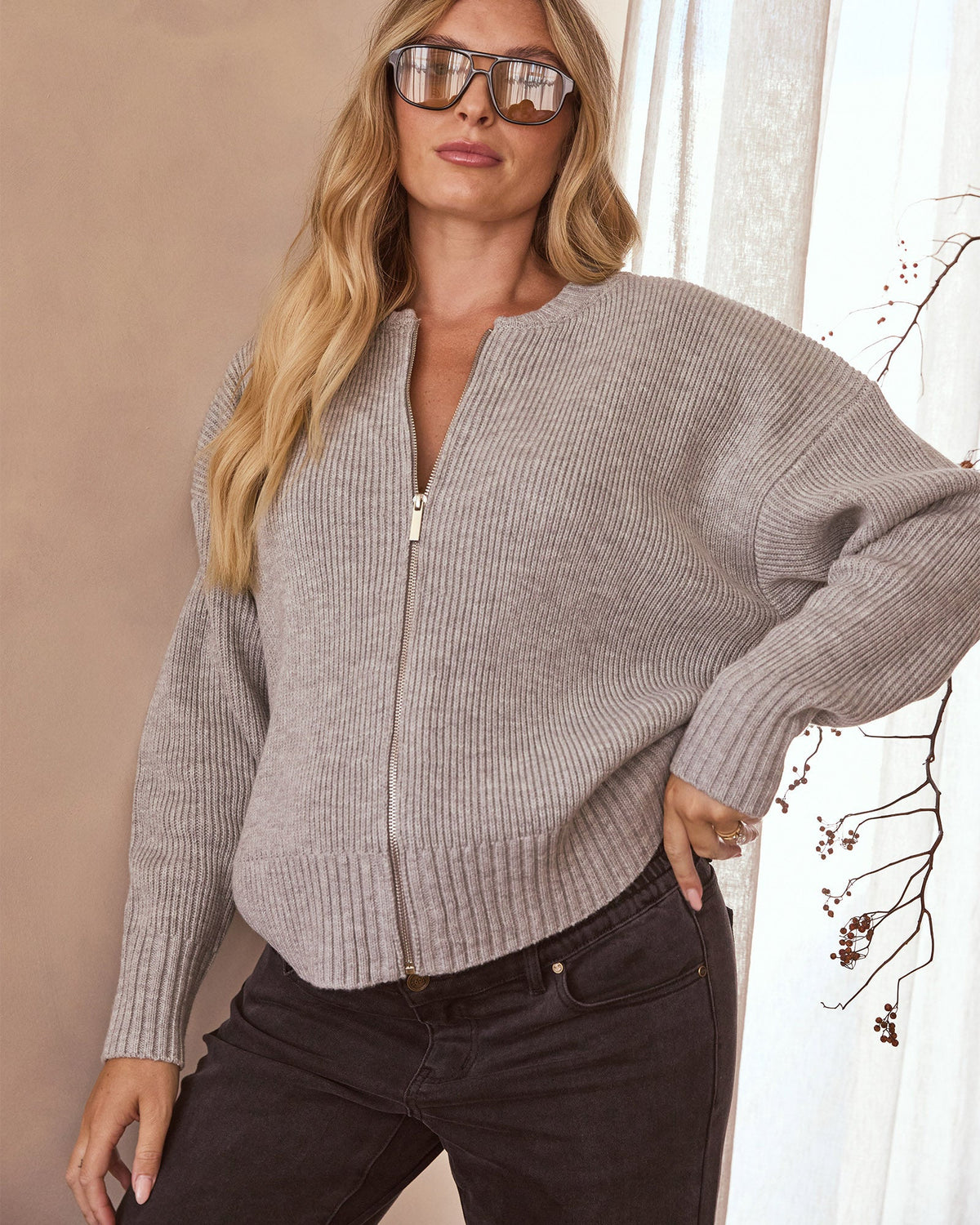 Image of a model wearing Outerwear. Product name - Recycled Cashmere Knit Bomber in colour by brand - Soon Maternity