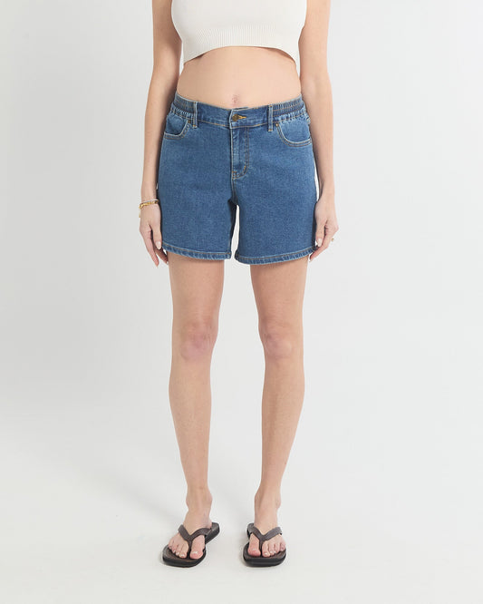 Image of a model wearing Shorts. Product name - Relaxed Denim Shorts in colour by brand - Soon Maternity