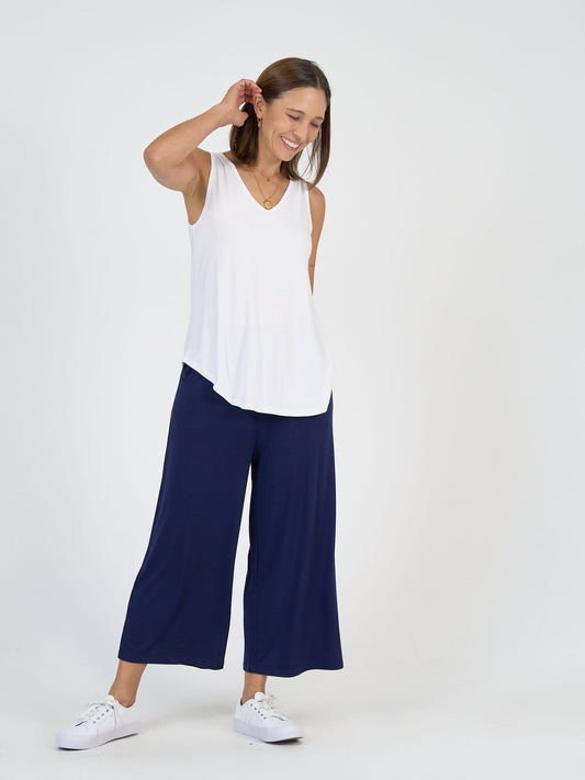 Image of a model wearing Tops. Product name - Rihanna V-Neck Bamboo Tank Top White in White colour by brand - Lou Lou