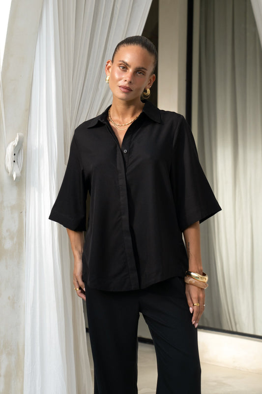 Image of a model wearing Tops. Productname: Heychic Rize Black Shirt in Black colour by brand - Heychic