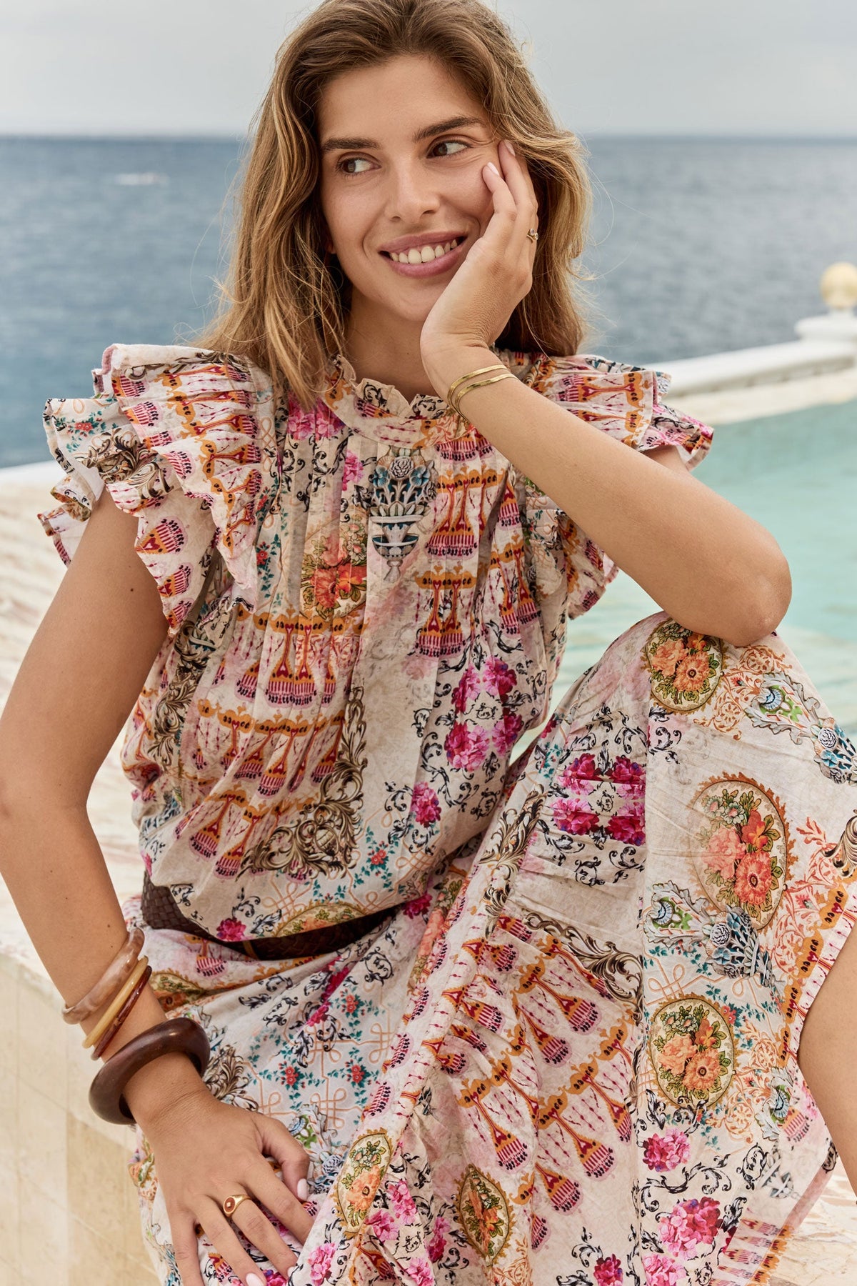 Image of a model wearing Tops. Product name - Rubyyaya Rosetta Top Gold in Gold colour by brand - Rubyyaya