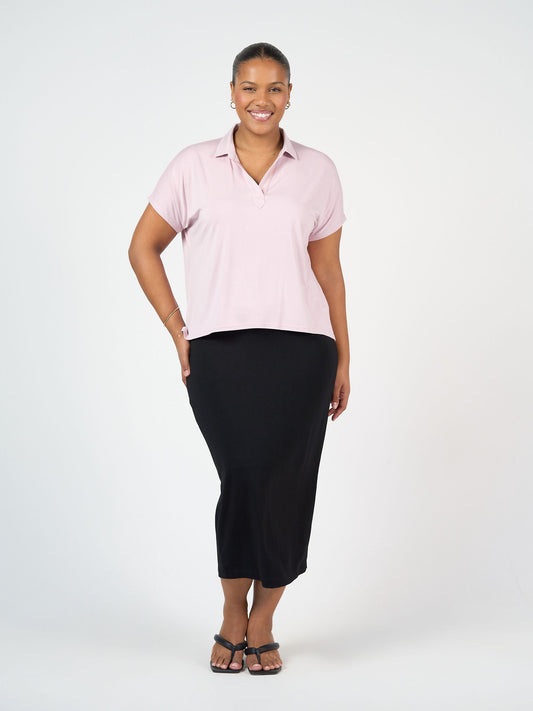Image of a model wearing Skirts. Product name - Maxi Bamboo Whitney Tube Skirt Black in Black colour by brand - Lou Lou
