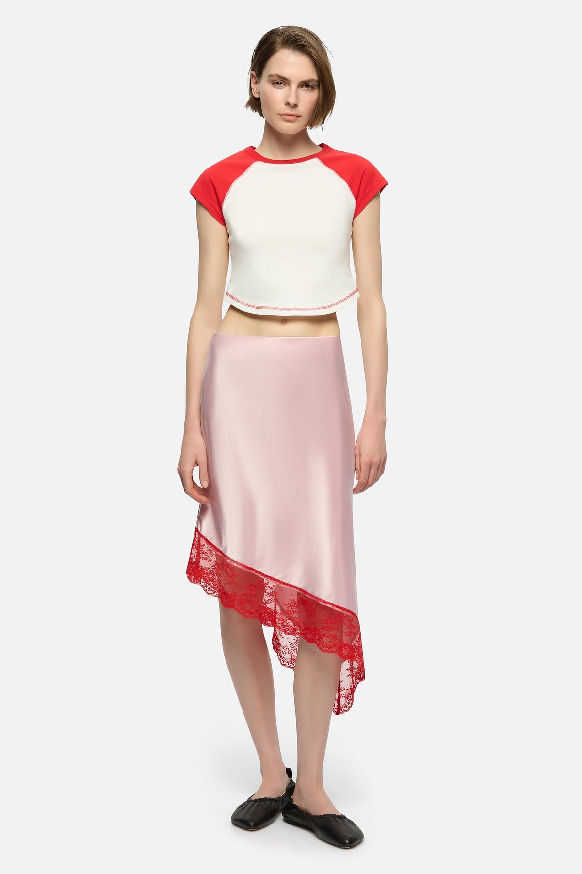 Image of a model wearing Skirts. Product name - Sabine Skirt in Pink colour by brand - Blanca Studio