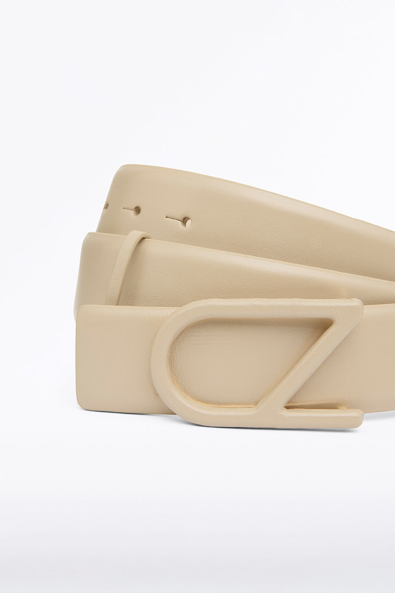 Image of Belts. Product name - Nude Cz Logo Covered Belt in Semolina colour by brand - Carla Zampatti