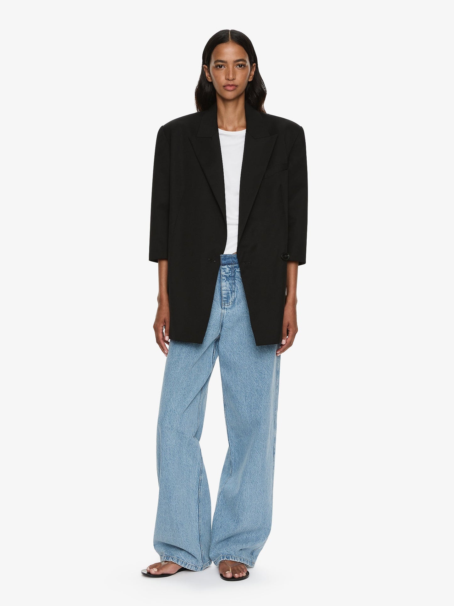 Image of a model wearing Outerwear. Productname: CHRISTOPHER ESBER Didion Tailored Crop Sleeve Blazer in Black colour by brand - CHRISTOPHER ESBER