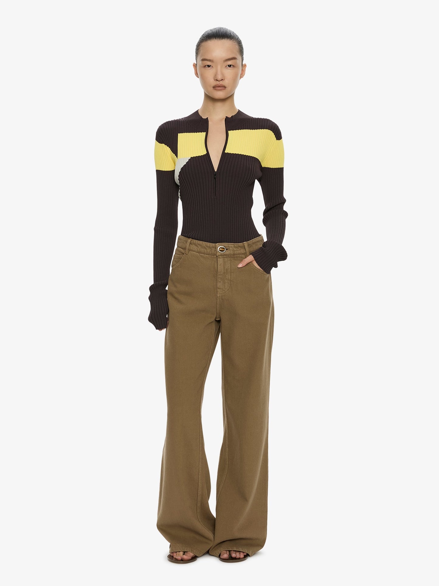 Image of a model wearing Pants. Product name - Relaxed Denim Quartz Jean in Khaki colour by brand - CHRISTOPHER ESBER