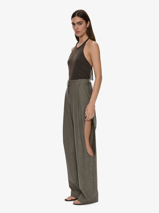 Image of a model wearing Pants. Product name - Sirocco Twill Trouser in Stone colour by brand - CHRISTOPHER ESBER