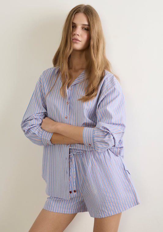 Image of a model wearing Shorts. Productname: Auguste The Label Joe Shorts in Blue colour by brand - Auguste The Label