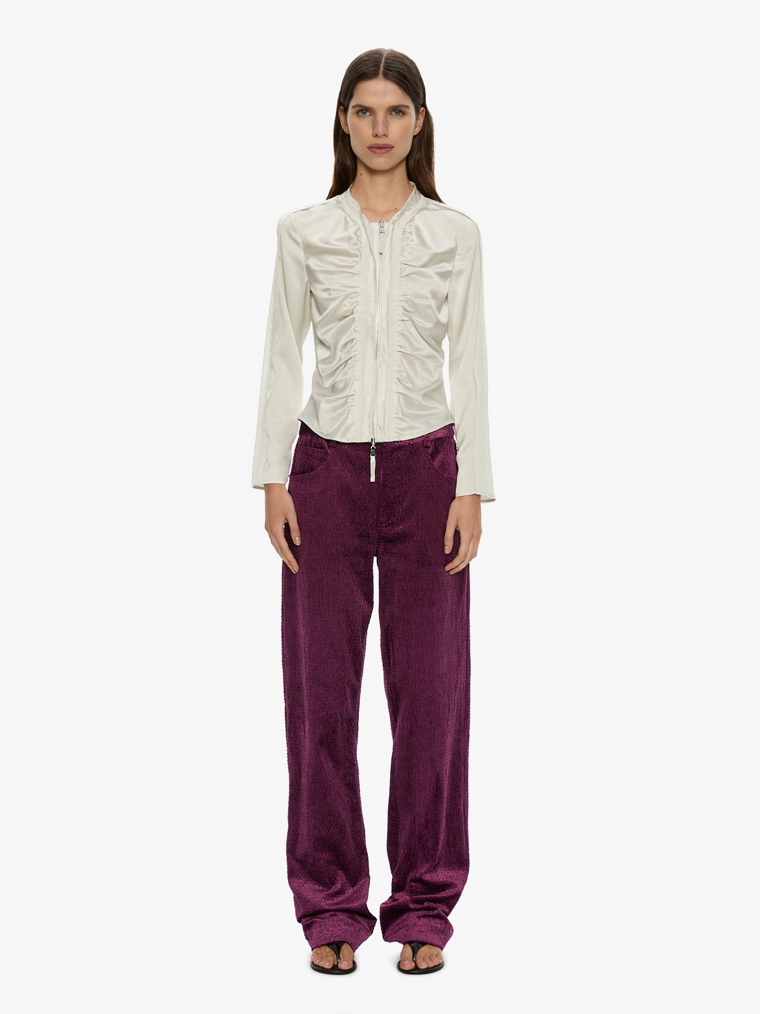 Image of a model wearing Pants. Product name - Ava Sateen Corduroy Jean in Plum colour by brand - CHRISTOPHER ESBER