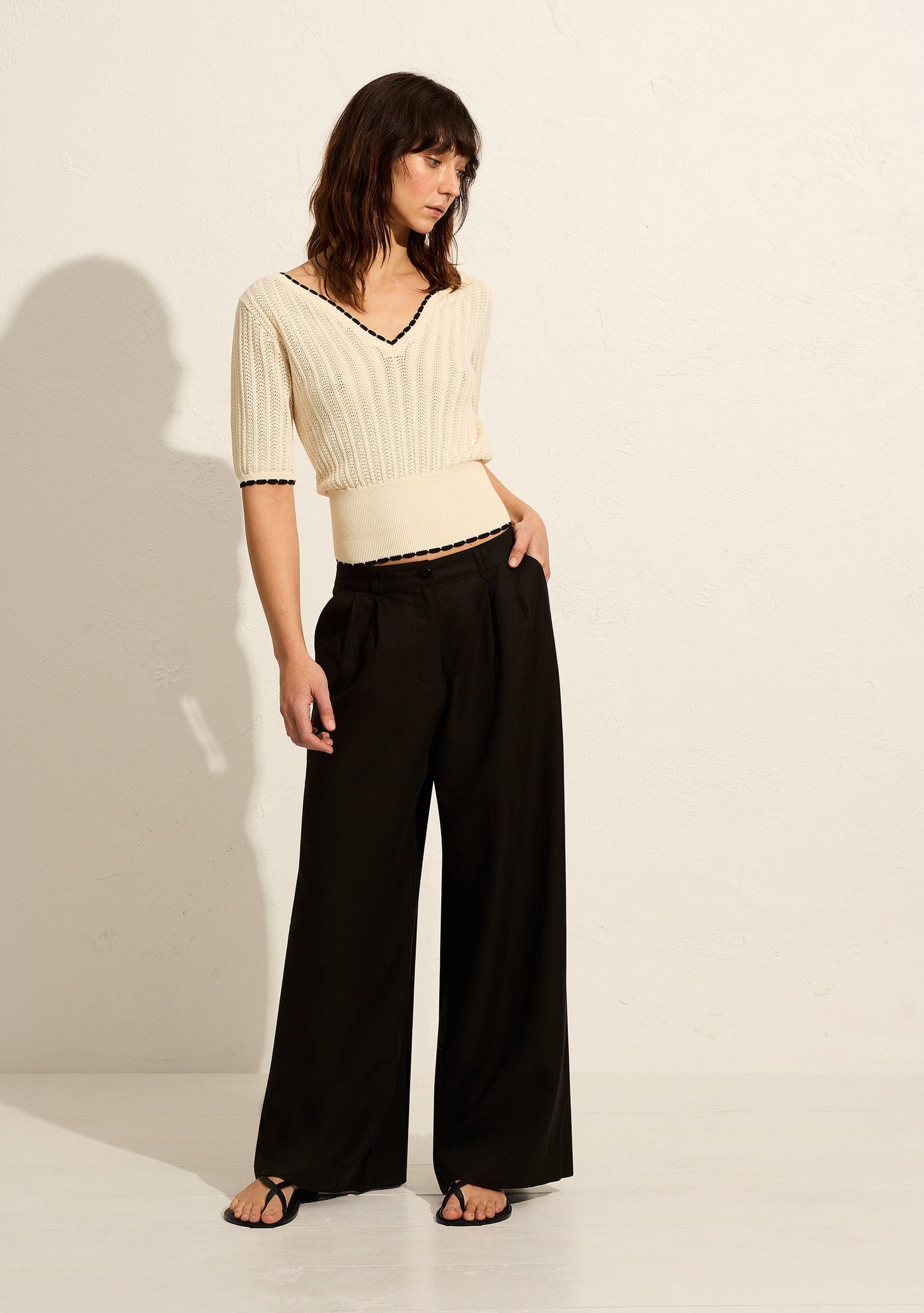 Image of a model wearing Pants. Productname: Auguste The Label Hensley Pant in Black colour by brand - Auguste The Label
