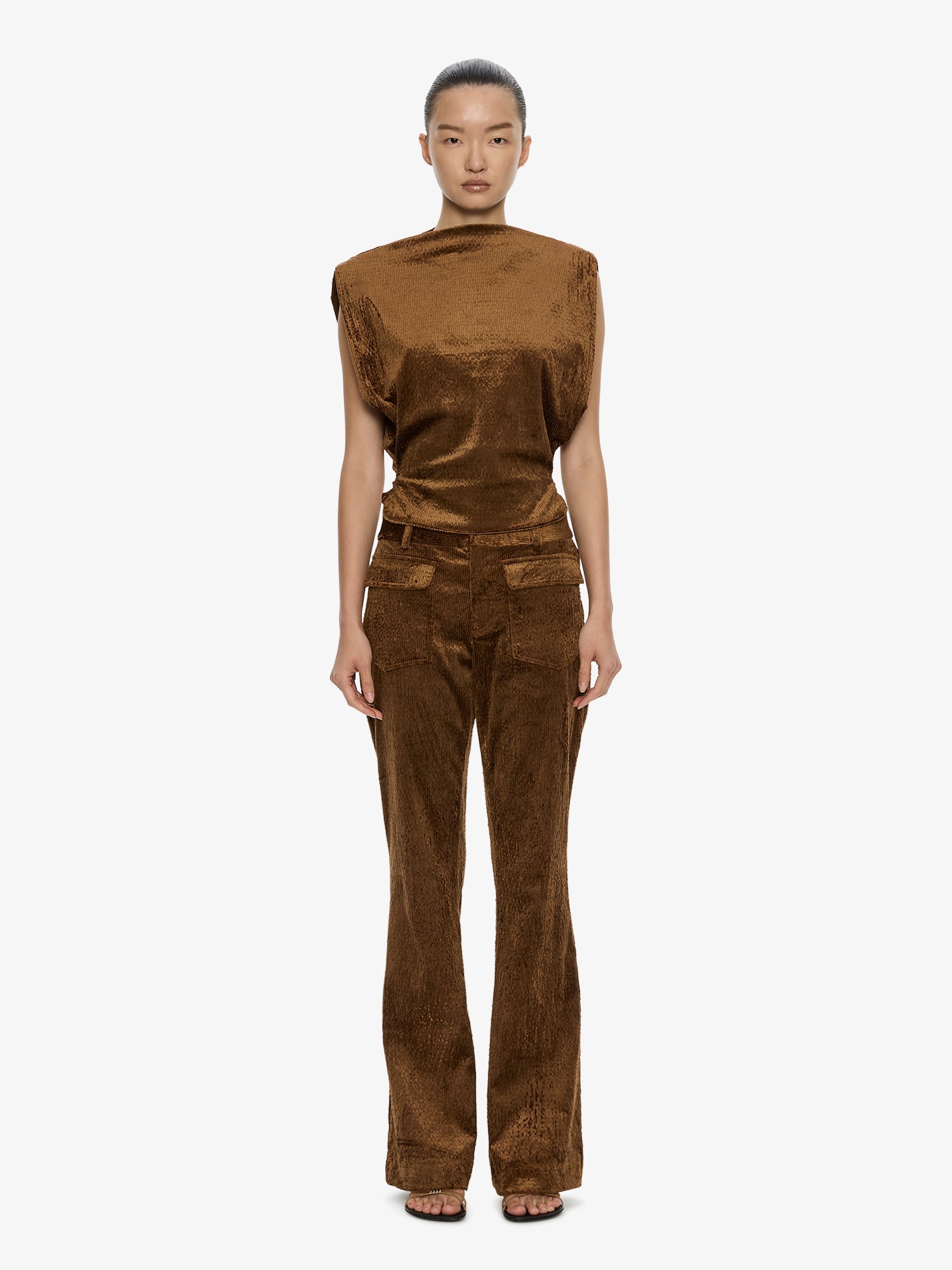 Image of a model wearing Pants. Product name - Enne Pant in Cognac colour by brand - CHRISTOPHER ESBER