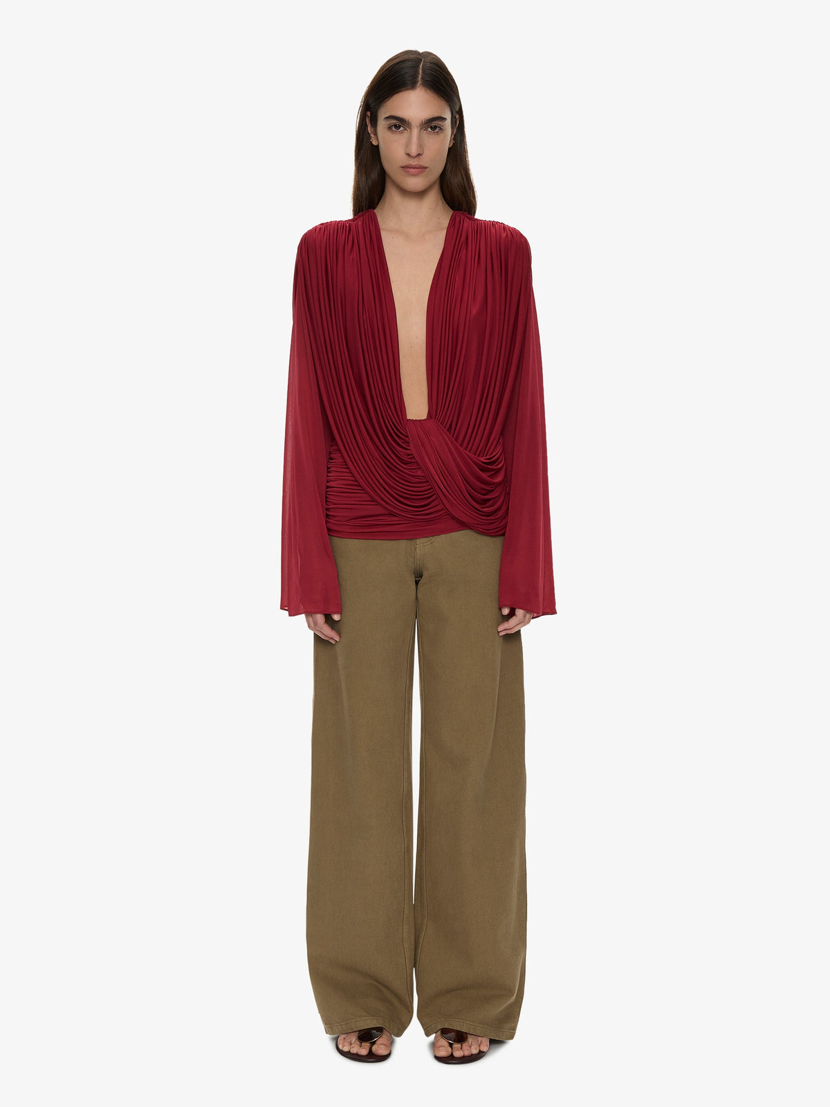 Image of a model wearing Tops. Product name - Ripple Drape Long Sleeve Top in Wine colour by brand - CHRISTOPHER ESBER