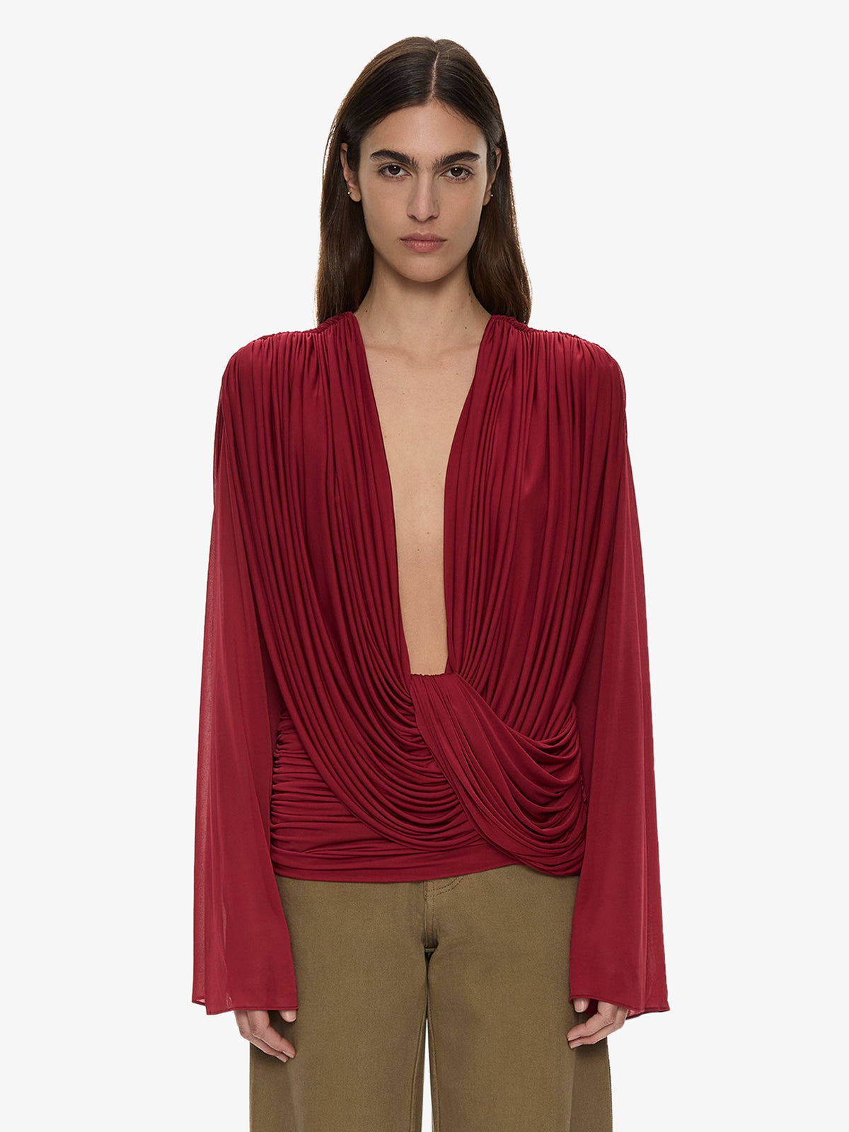 Image of a model wearing Tops. Product name - Ripple Drape Long Sleeve Top in Wine colour by brand - CHRISTOPHER ESBER