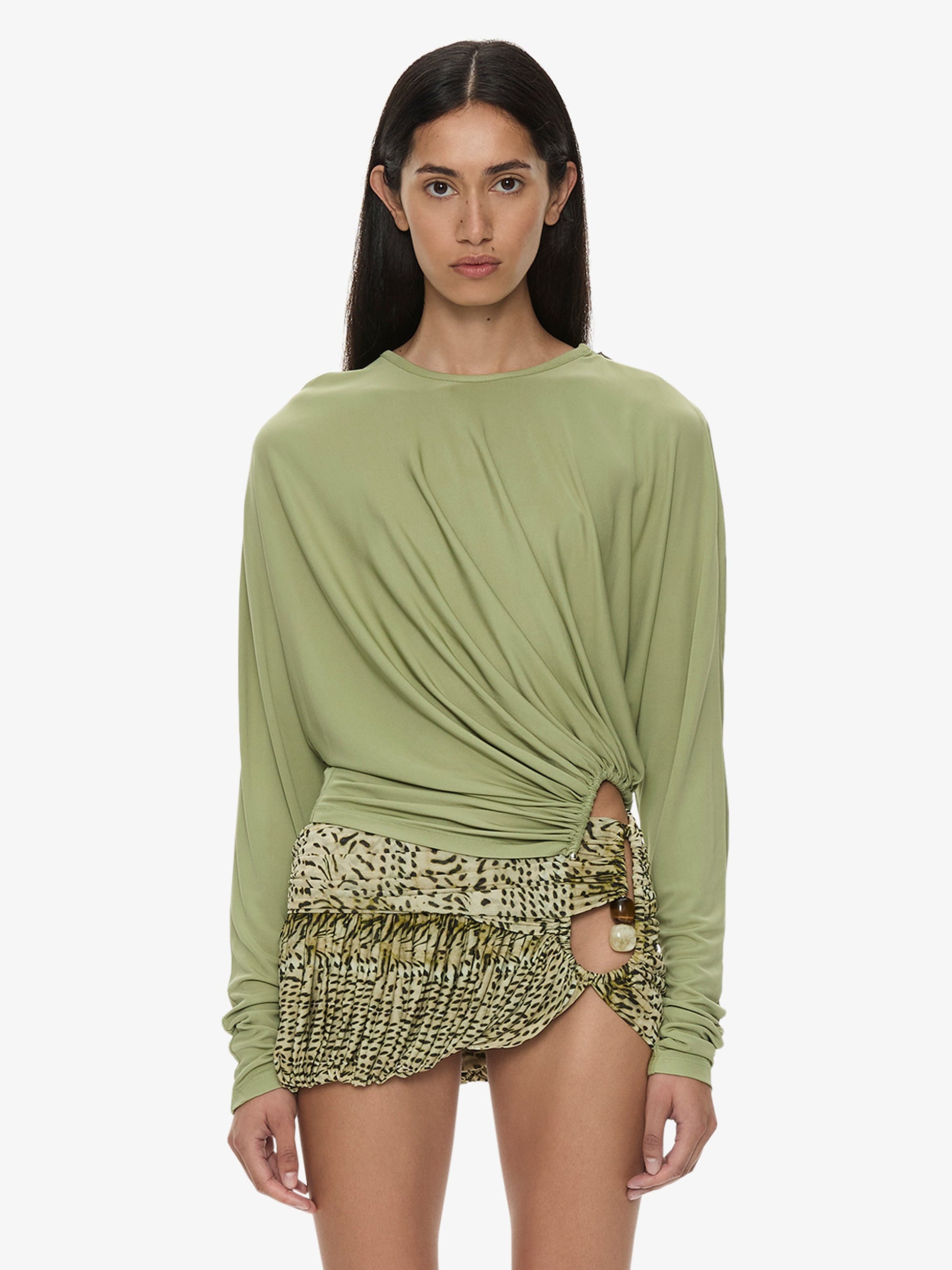 Image of a model wearing Tops. Product name - Manto Long Sleeve Jersey Top in Fennel colour by brand - CHRISTOPHER ESBER