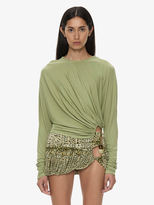 Image of a model wearing Tops. Product name - Manto Long Sleeve Jersey Top in Fennel colour by brand - CHRISTOPHER ESBER