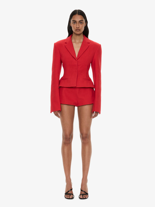 Image of a model wearing Shorts. Product name - Marnette Tailored Short in Red colour by brand - CHRISTOPHER ESBER