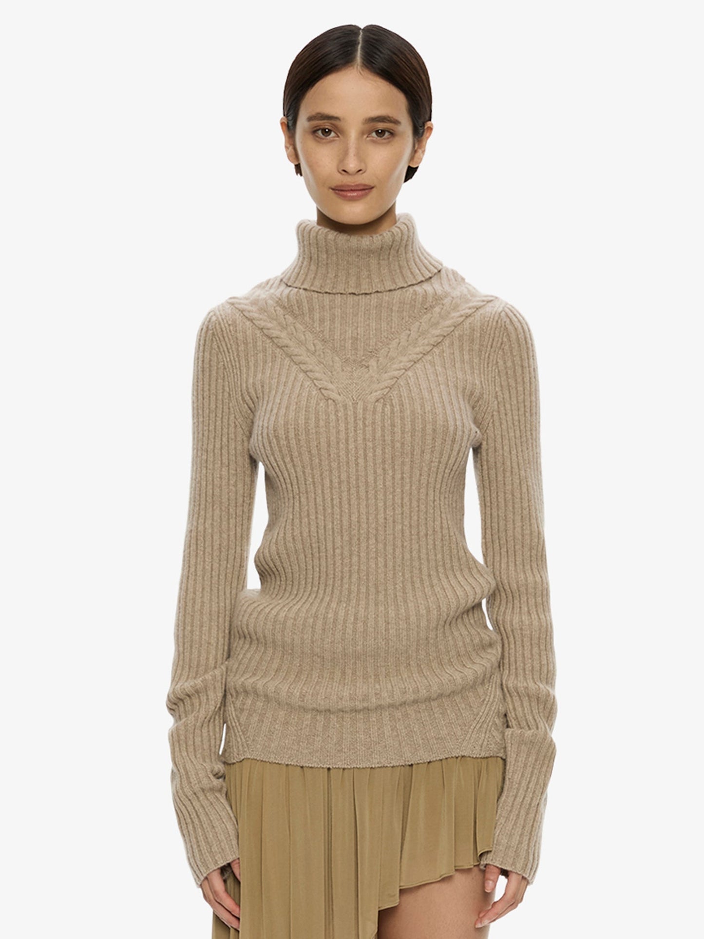 Image of a model wearing Tops. Product name - Caia Cable Knit Turtleneck in Jute colour by brand - CHRISTOPHER ESBER