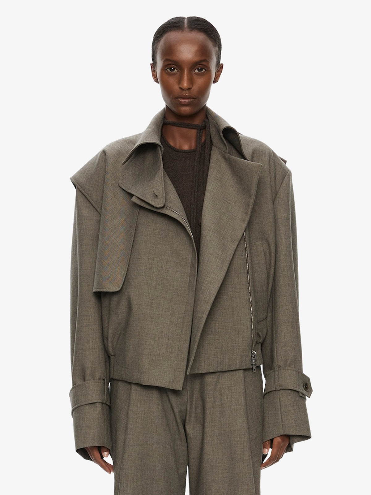 Image of a model wearing Outerwear. Product name - Cropped Trench Bomber Jacket in Pink colour by brand - CHRISTOPHER ESBER