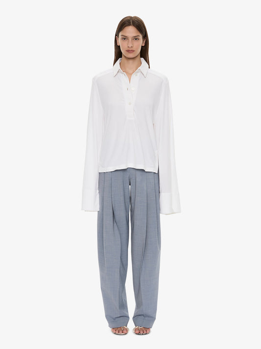Image of a model wearing Pants. Product name - Plinth Tailored Trouser in Lightwash colour by brand - CHRISTOPHER ESBER