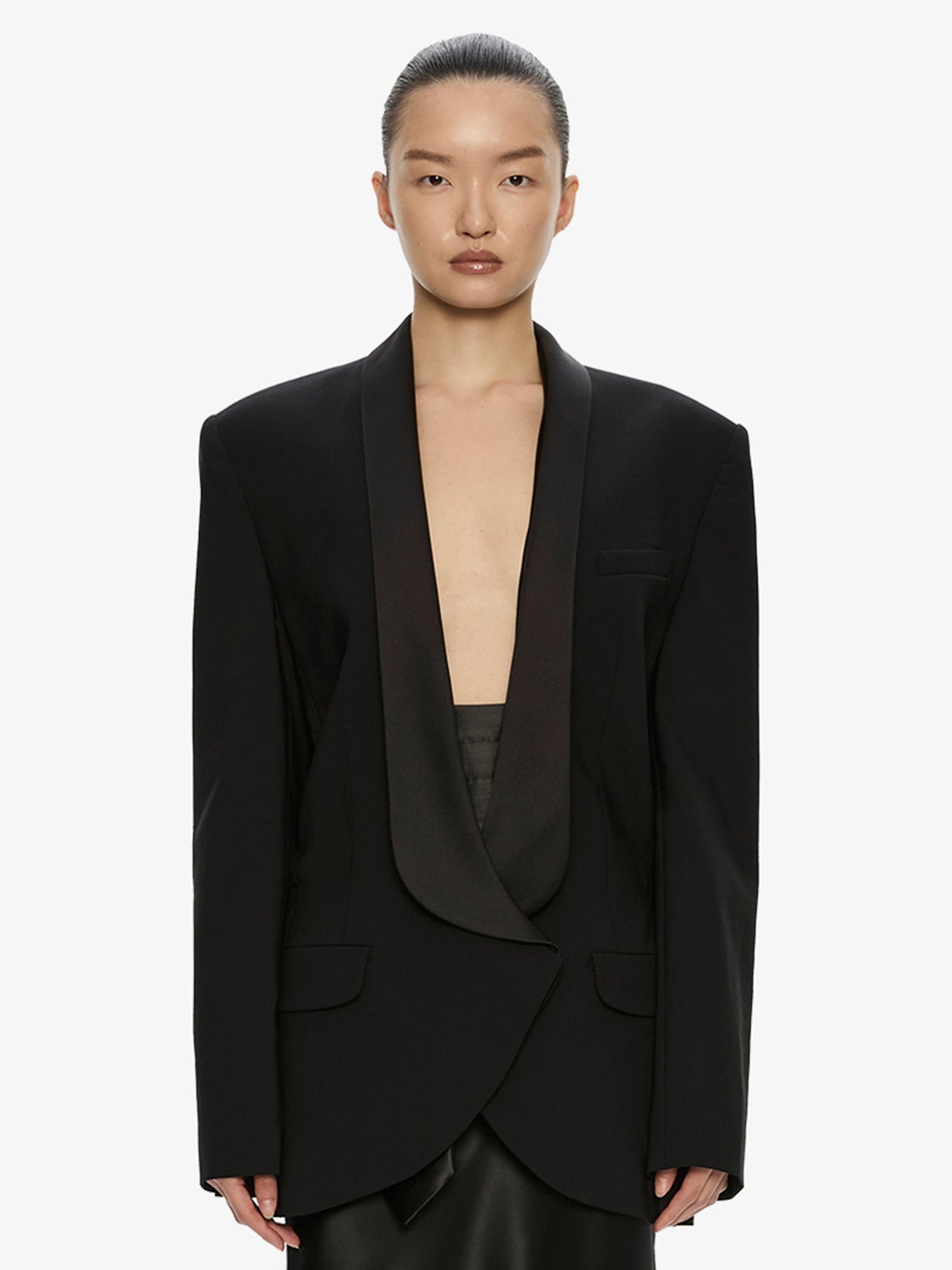 Image of a model wearing Outerwear. Product name - Tuxedo Contrast Wool Blazer in Black colour by brand - CHRISTOPHER ESBER