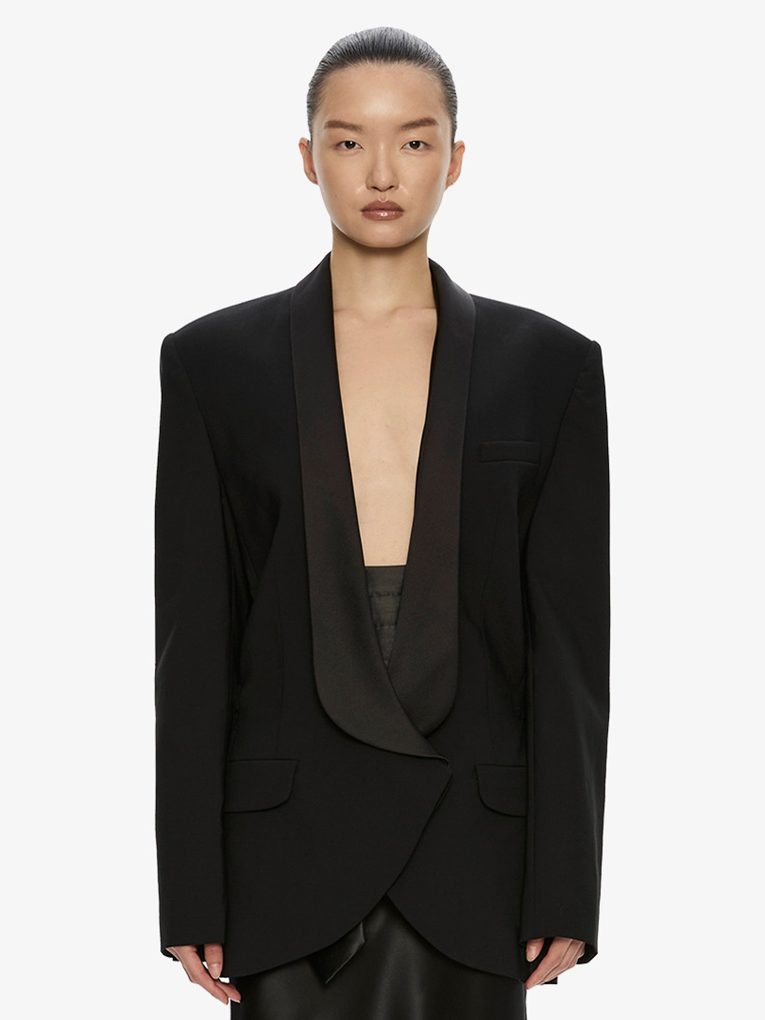 Image of a model wearing Outerwear. Product name - Tuxedo Contrast Wool Blazer in Black colour by brand - CHRISTOPHER ESBER