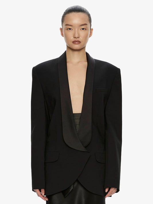Image of a model wearing Outerwear. Product name - Tuxedo Contrast Wool Blazer in Black colour by brand - CHRISTOPHER ESBER