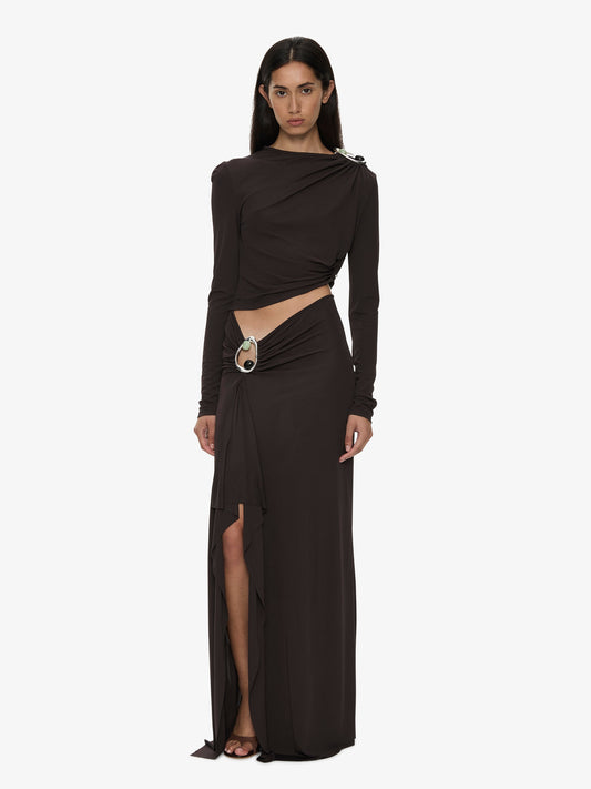 Image of a model wearing Skirts. Product name - Orica Crystal Cascade Jersey Skirt in Molasses colour by brand - CHRISTOPHER ESBER