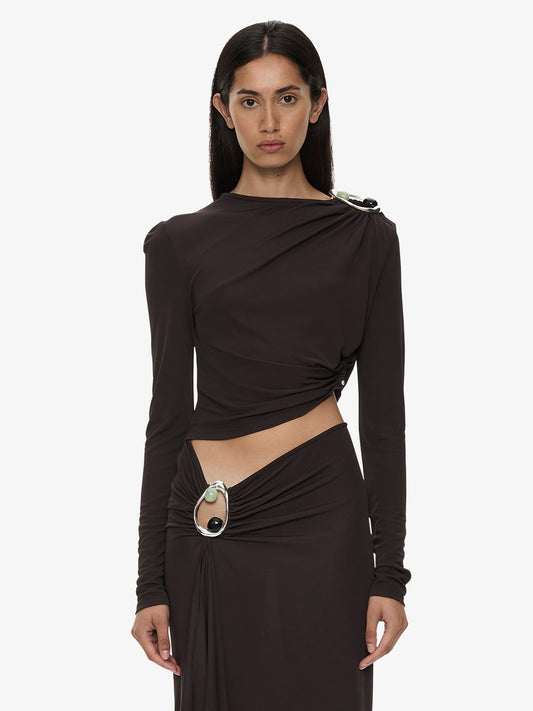 Image of a model wearing Tops. Product name - Orica Crystal Ruched Long Sleeve Top in Molasses colour by brand - CHRISTOPHER ESBER