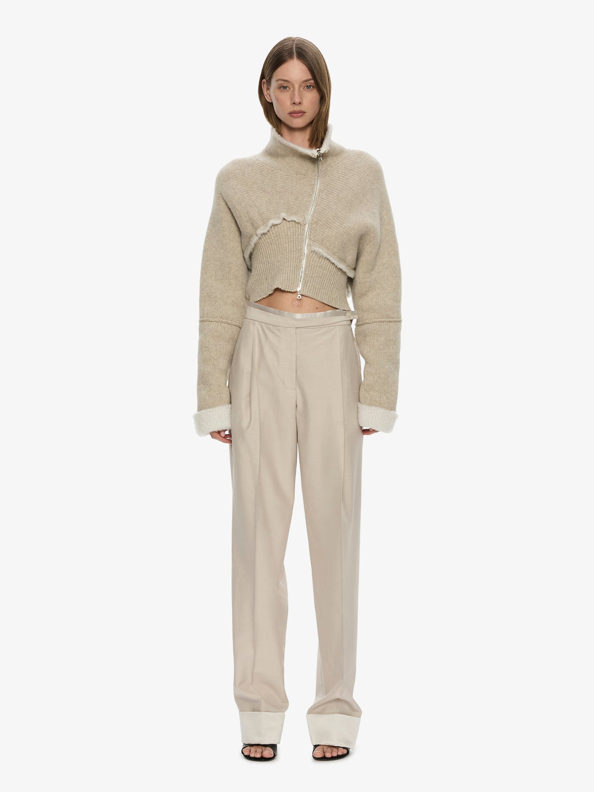 Image of a model wearing Pants. Product name - Rowan Sateen Cuffed Trouser in Silver colour by brand - CHRISTOPHER ESBER