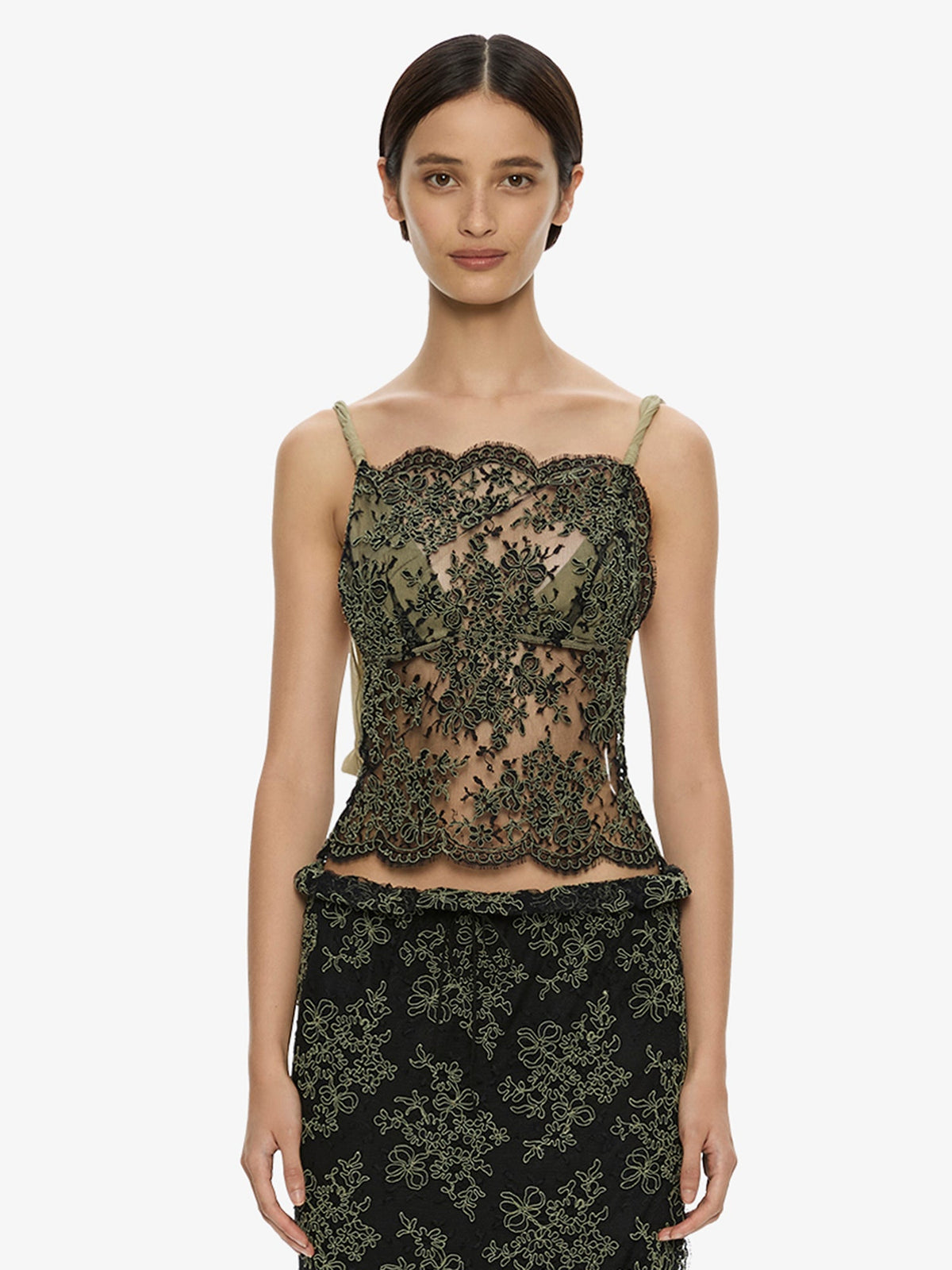 Image of a model wearing Tops. Product name - Aluna Lace Draped Top in Charcoal colour by brand - CHRISTOPHER ESBER