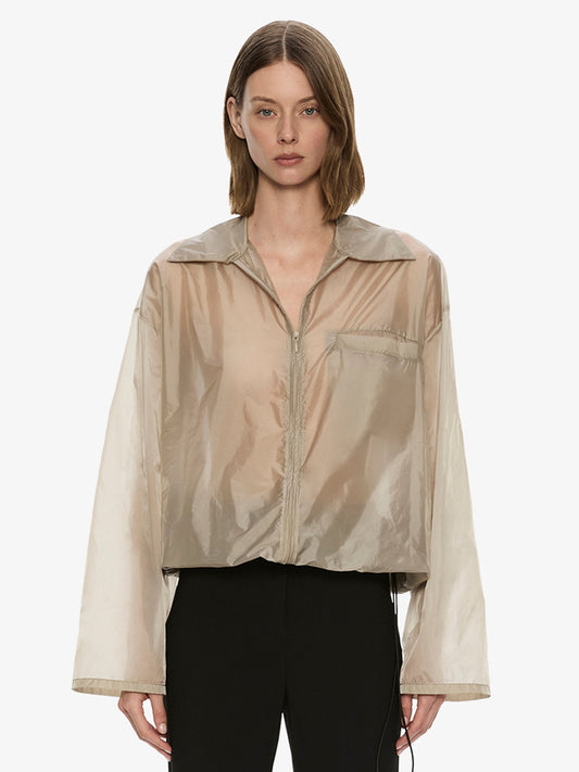 Image of a model wearing Outerwear. Product name - Lucent Spray Jacket in Bone colour by brand - CHRISTOPHER ESBER