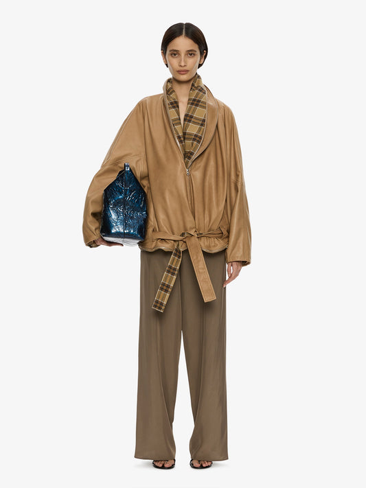 Image of a model wearing Outerwear. Product name - Mercer Double Jacket in Check colour by brand - CHRISTOPHER ESBER
