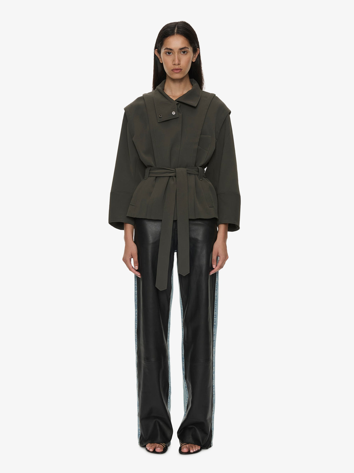 Image of a model wearing Outerwear. Product name - Virelle Parapet Drift Jacket in Green colour by brand - CHRISTOPHER ESBER