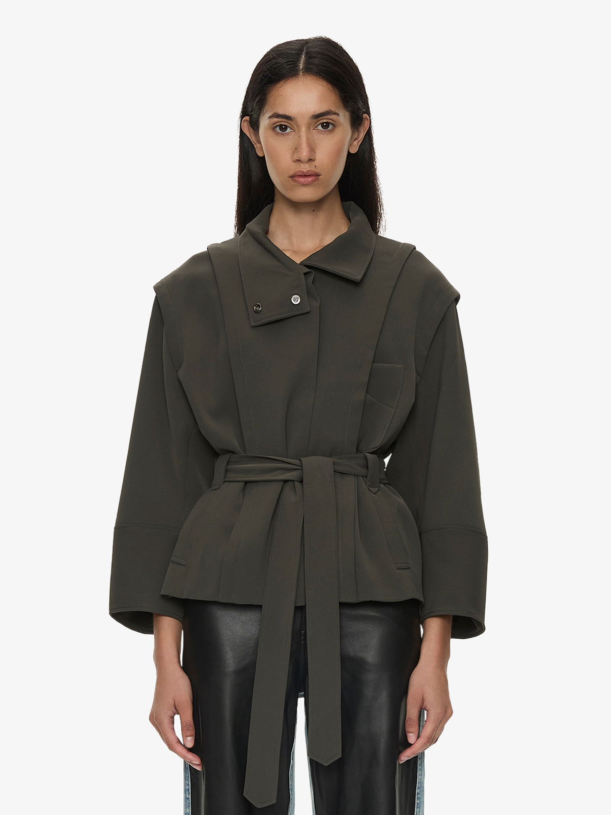 Image of a model wearing Outerwear. Product name - Virelle Parapet Drift Jacket in Green colour by brand - CHRISTOPHER ESBER