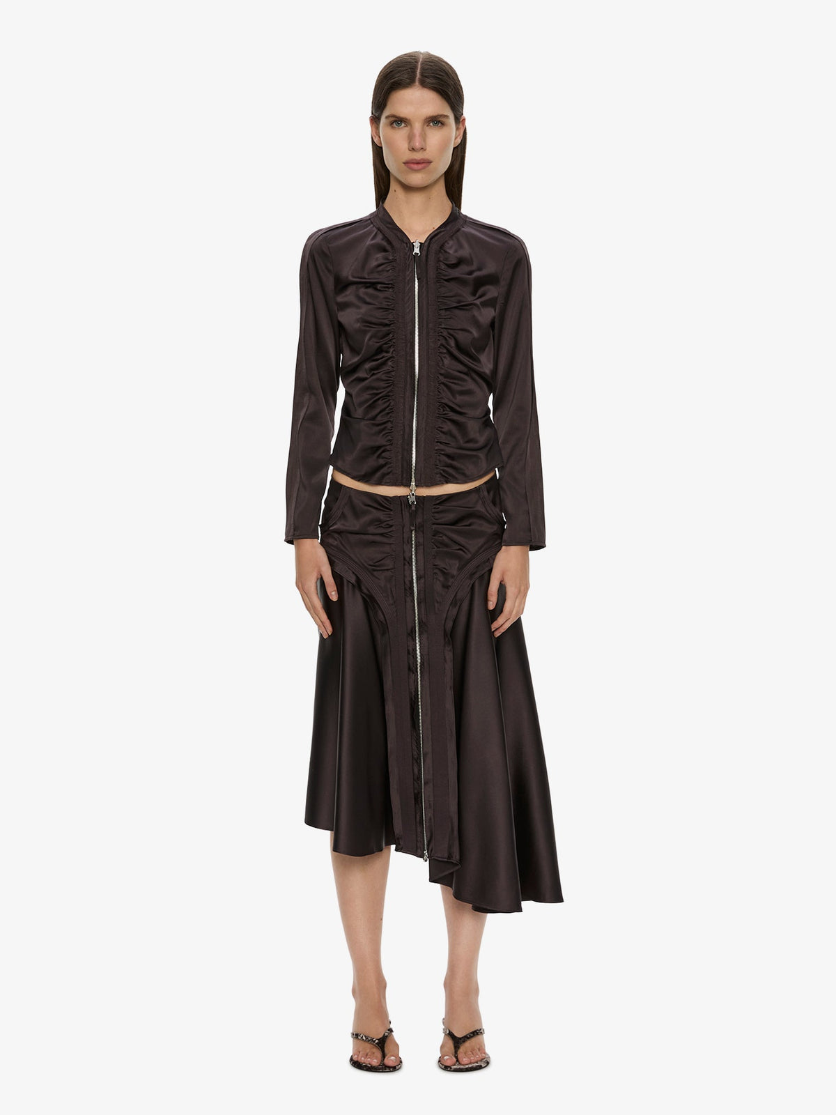 Image of a model wearing Skirts. Product name - Invert Silk Gwen Skirt in Molasses colour by brand - CHRISTOPHER ESBER
