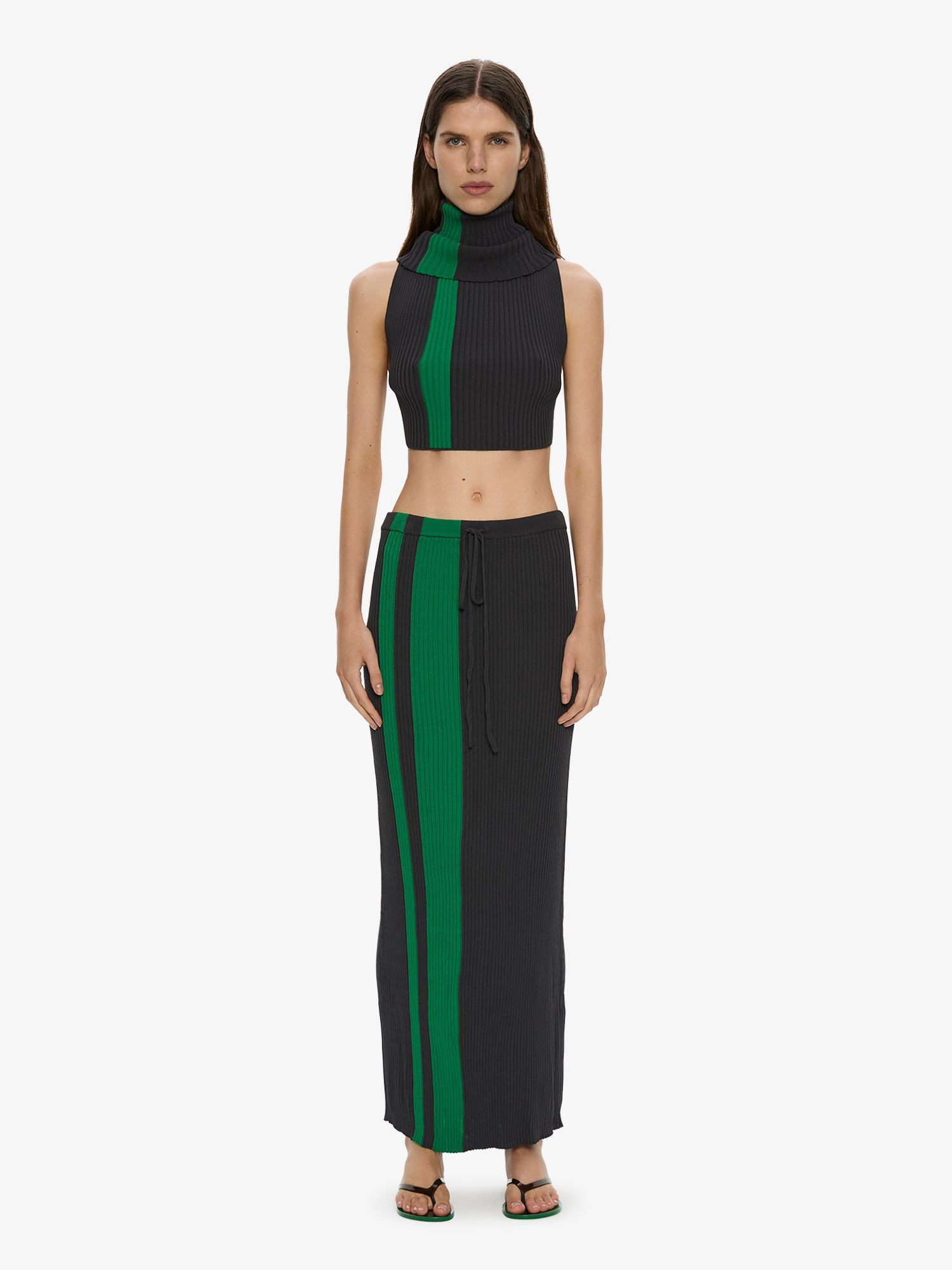 Image of a model wearing Skirts. Product name - Mach Stripe Tie Skirt in Black colour by brand - CHRISTOPHER ESBER