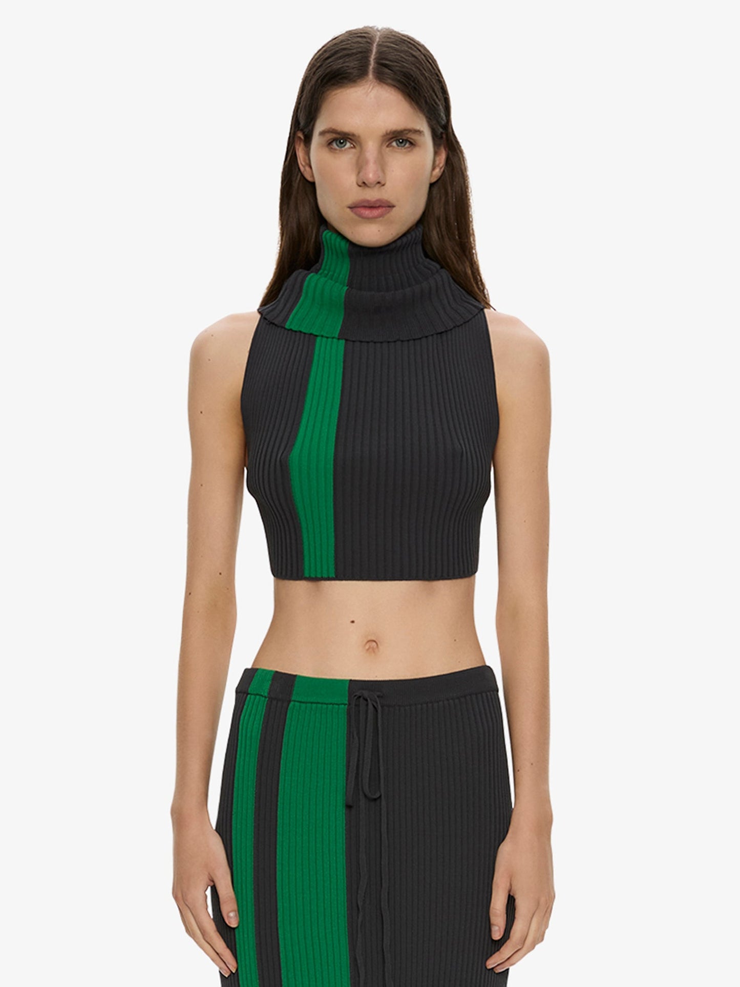 Image of a model wearing Tops. Product name - Mach Stripe Turtleneck Crop in Black colour by brand - CHRISTOPHER ESBER