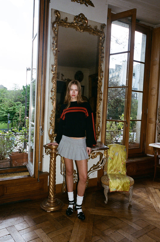 Image of a model wearing Skirts. Product name - Hudson Mini Skirt in Grey colour by brand - With Jéan