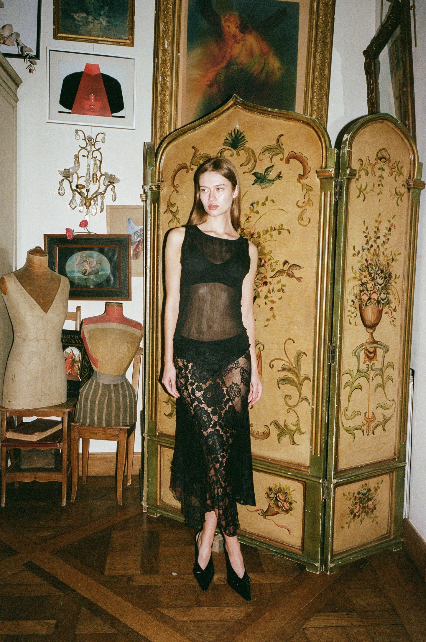 Image of a model wearing Skirts. Product name - Alexis Midi Skirt in Black colour by brand - With Jéan