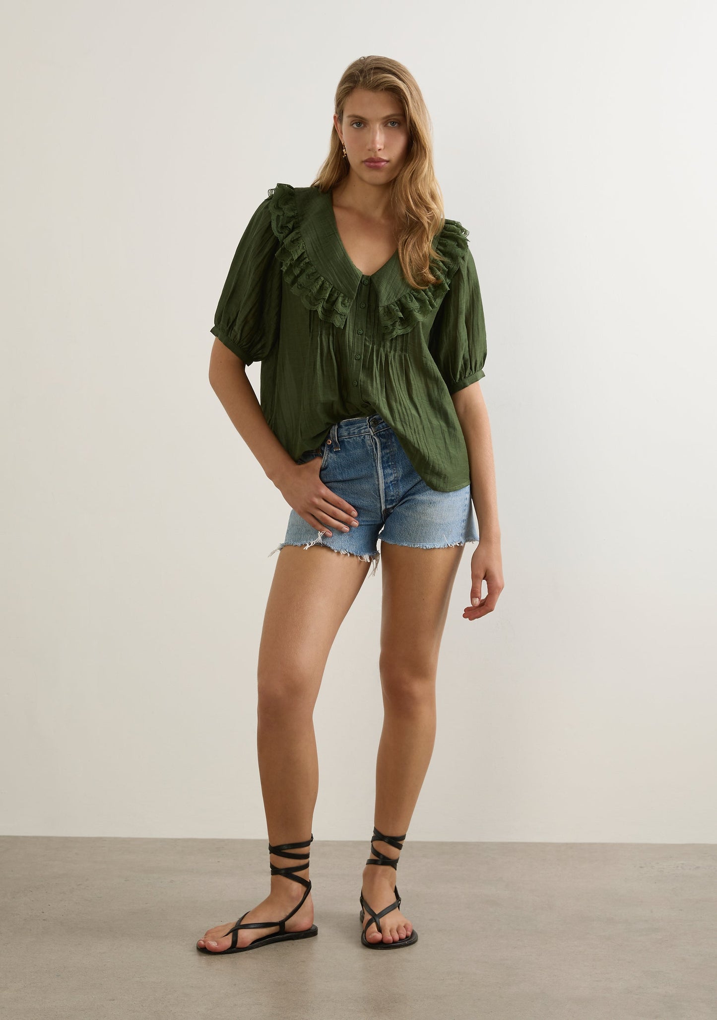 Image of a model wearing Tops. Productname: Auguste The Label Otis Blouse in Green colour by brand - Auguste The Label