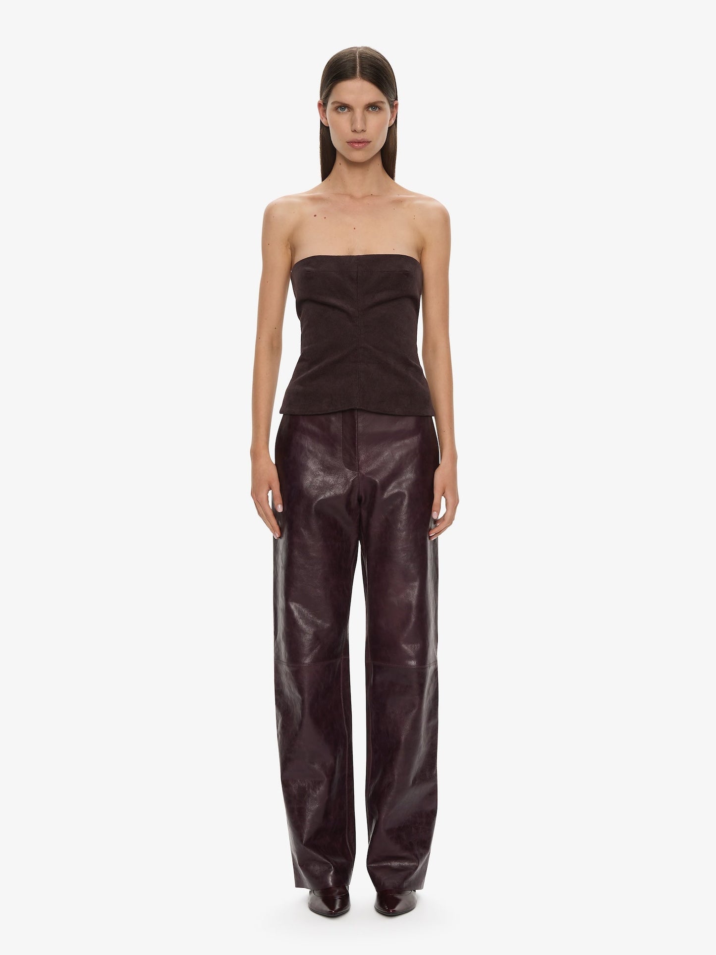 Image of a model wearing Pants. Productname: CHRISTOPHER ESBER Redux Leather Trouser in Maroon colour by brand - CHRISTOPHER ESBER
