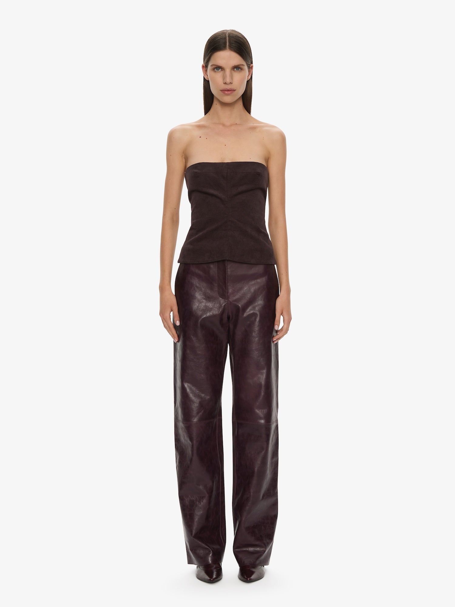 Image of a model wearing Pants. Productname: CHRISTOPHER ESBER Redux Leather Trouser in Maroon colour by brand - CHRISTOPHER ESBER