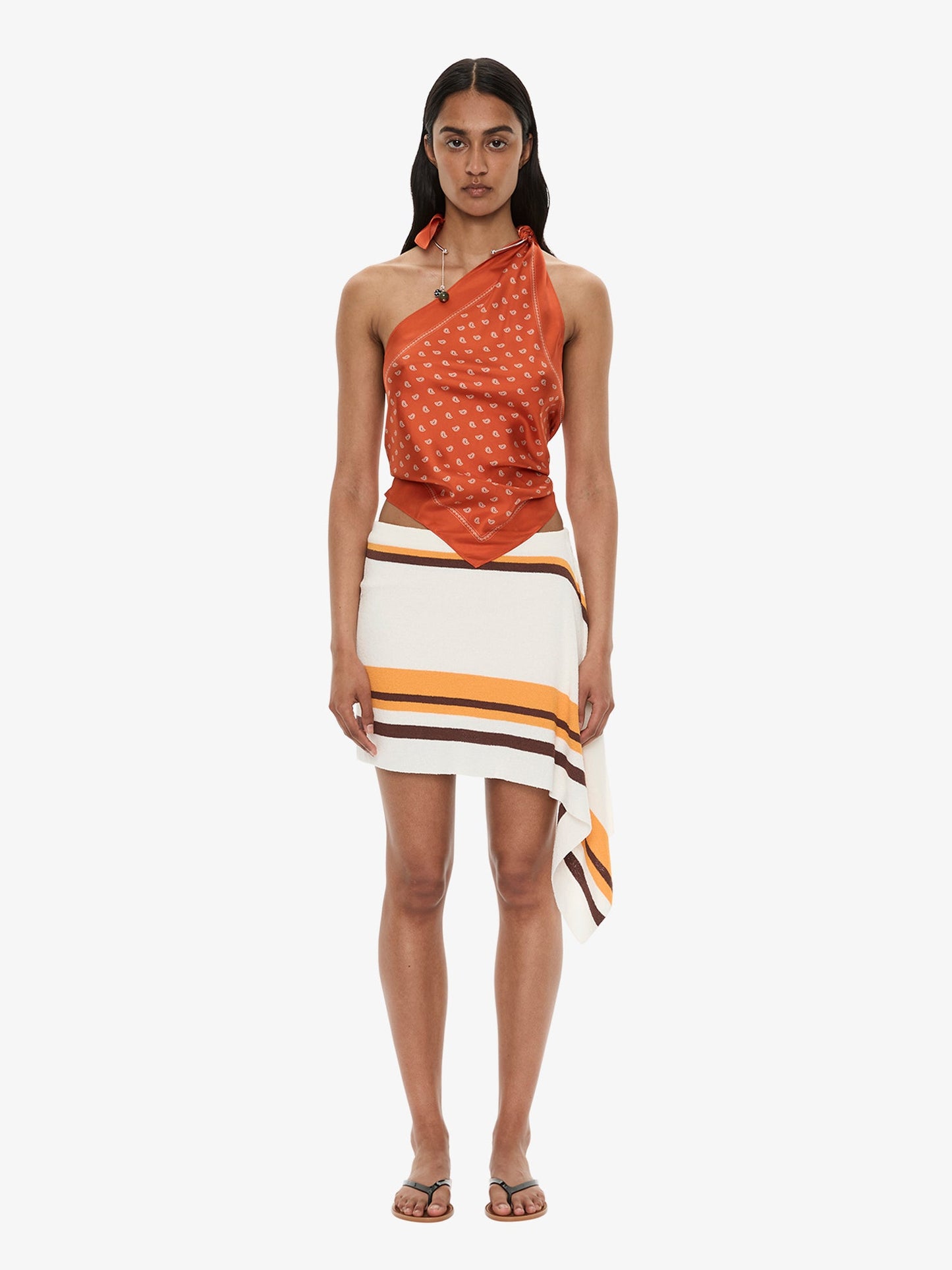 Image of a model wearing Skirts. Product name - Straccio Knitted Extension Drape Mini Skirt in Stripe colour by brand - CHRISTOPHER ESBER