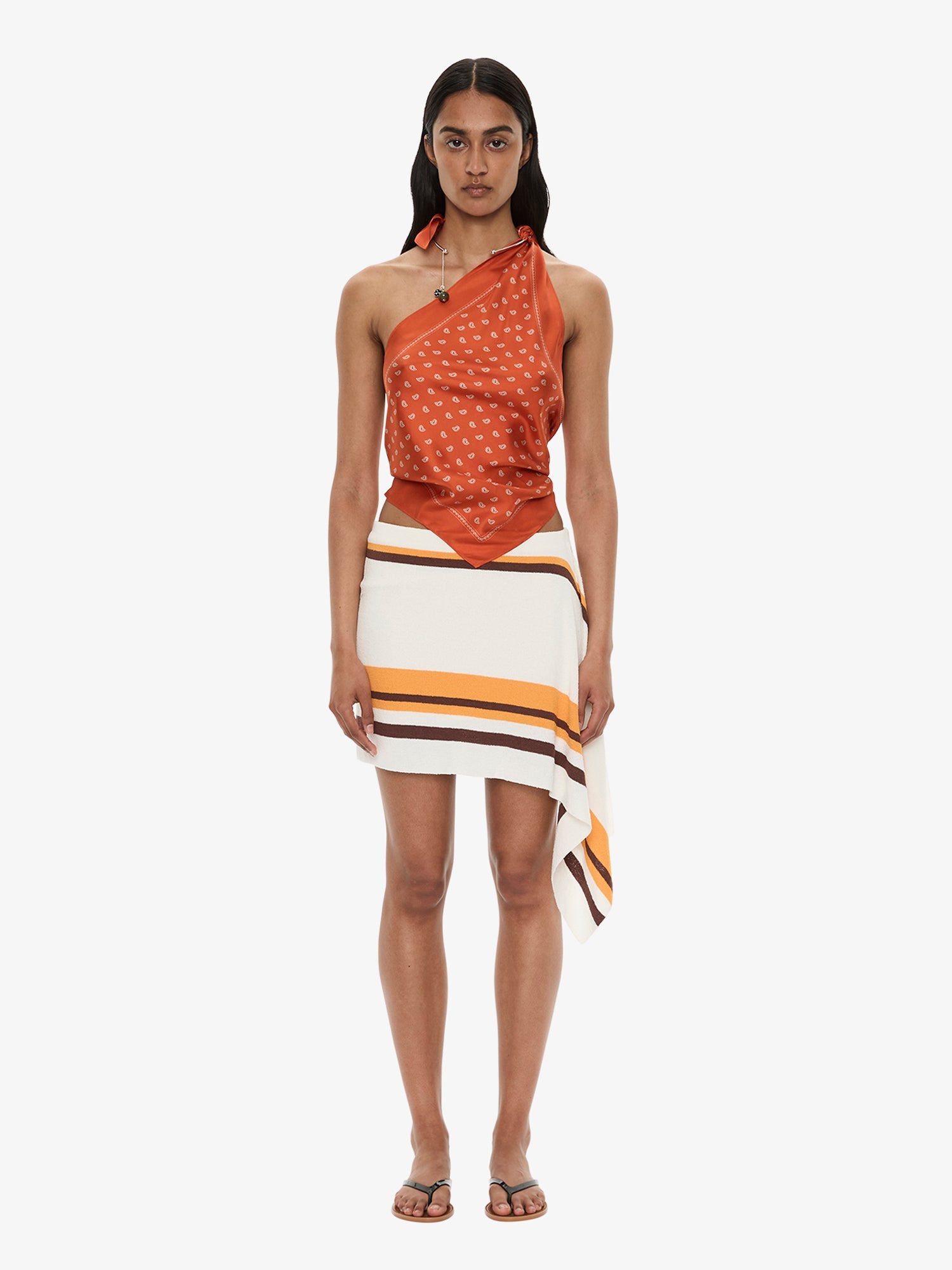 Image of a model wearing Skirts. Product name - Straccio Knitted Extension Drape Mini Skirt in Stripe colour by brand - CHRISTOPHER ESBER