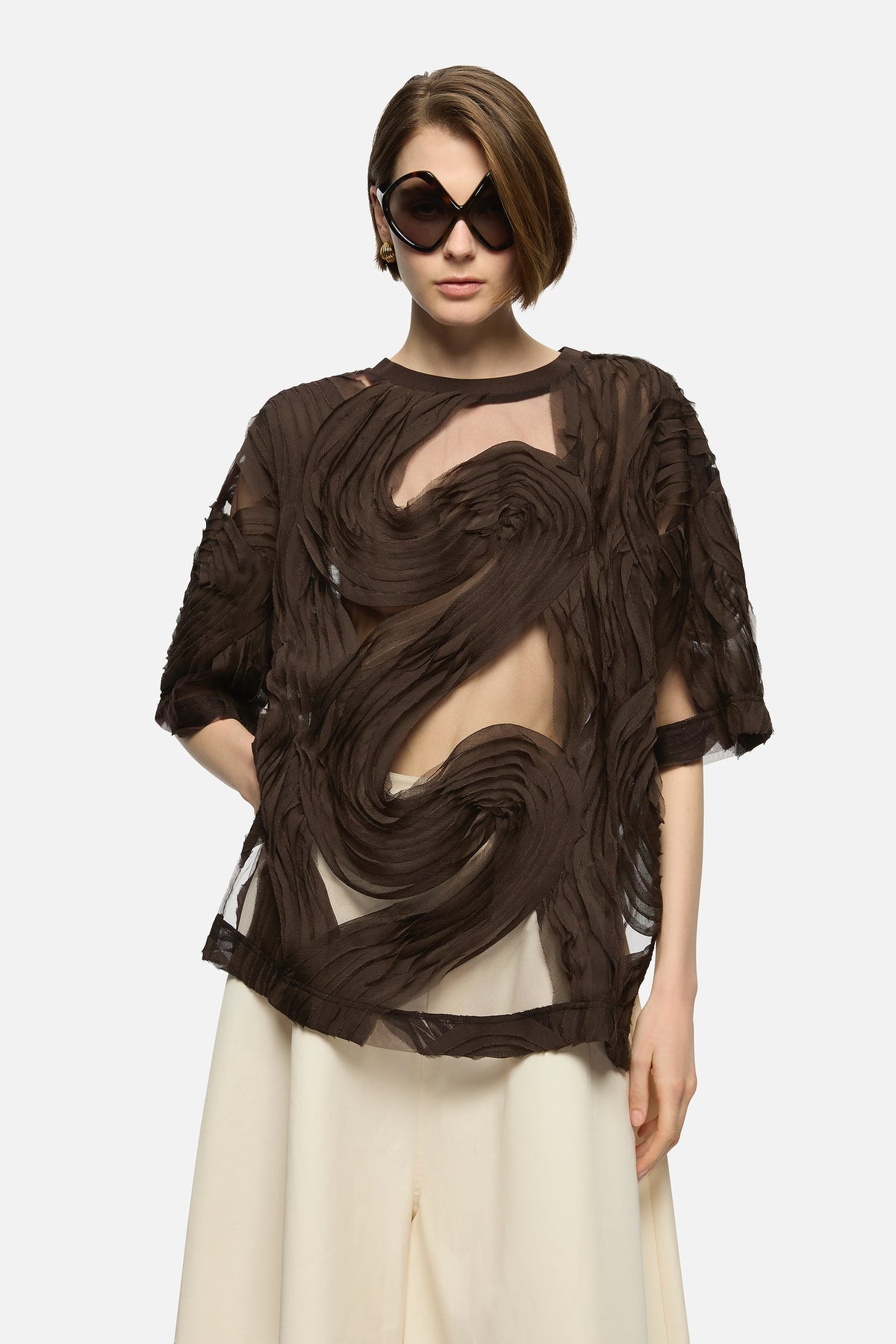 Image of a model wearing Tops. Product name - Delmare Top Brown in Brown colour by brand - Blanca Studio