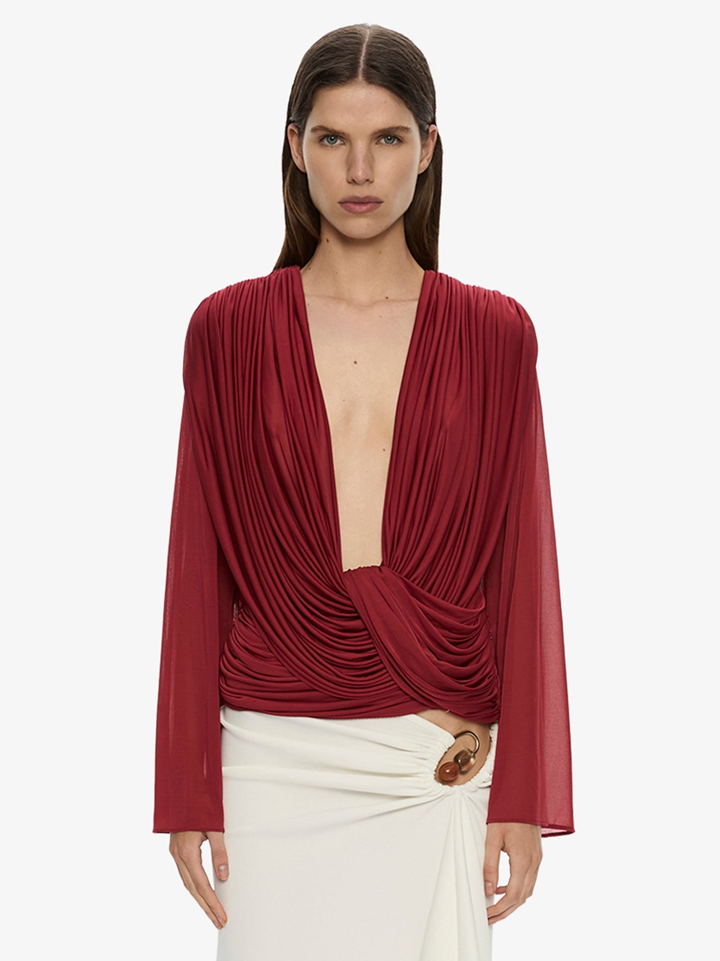 Image of a model wearing Tops. Product name - Ripple Drape Long Sleeve Top in Wine colour by brand - CHRISTOPHER ESBER
