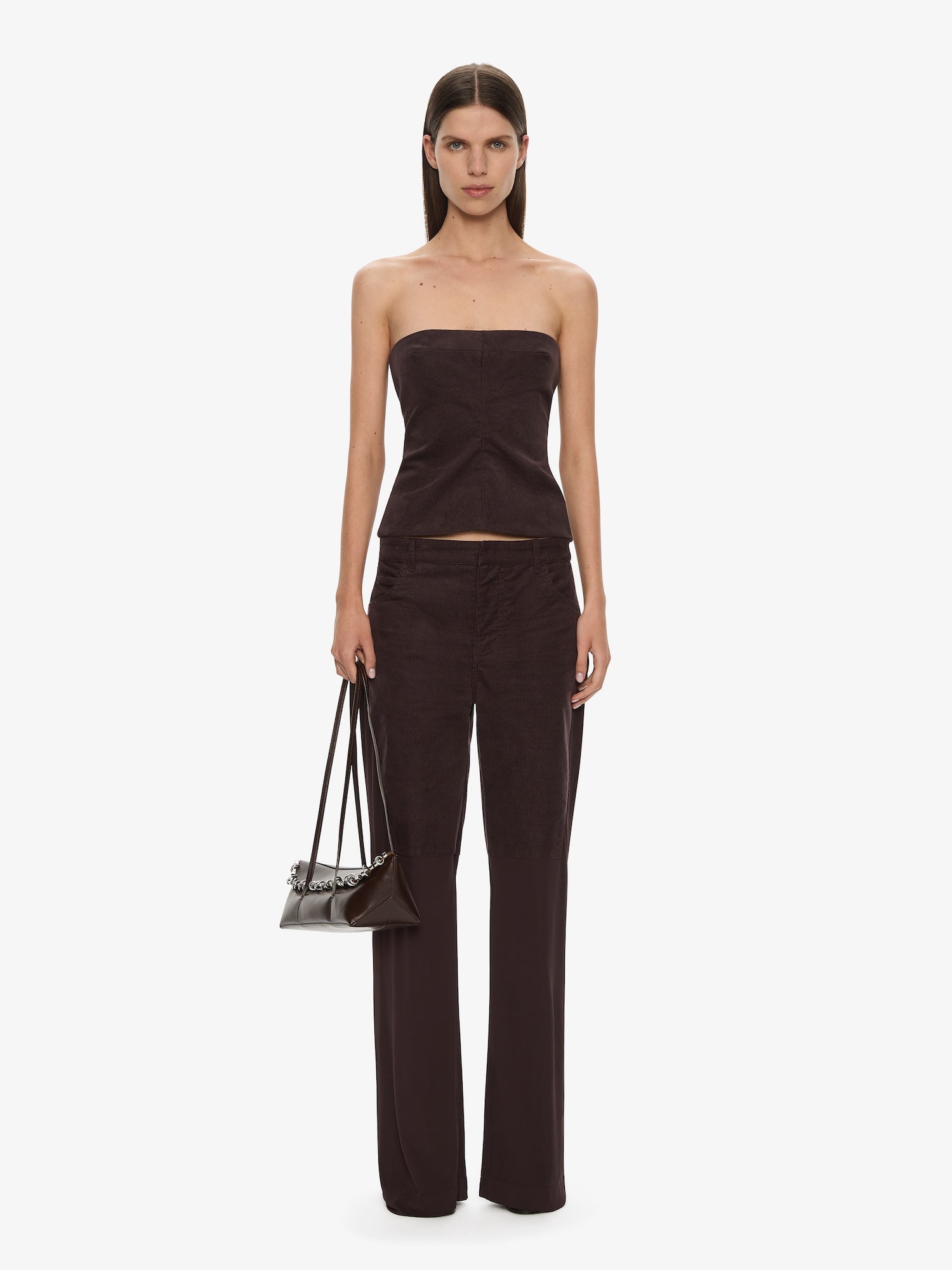 Image of a model wearing Pants. Productname: CHRISTOPHER ESBER Taped Corduroy Jersey Jean in Malbec colour by brand - CHRISTOPHER ESBER
